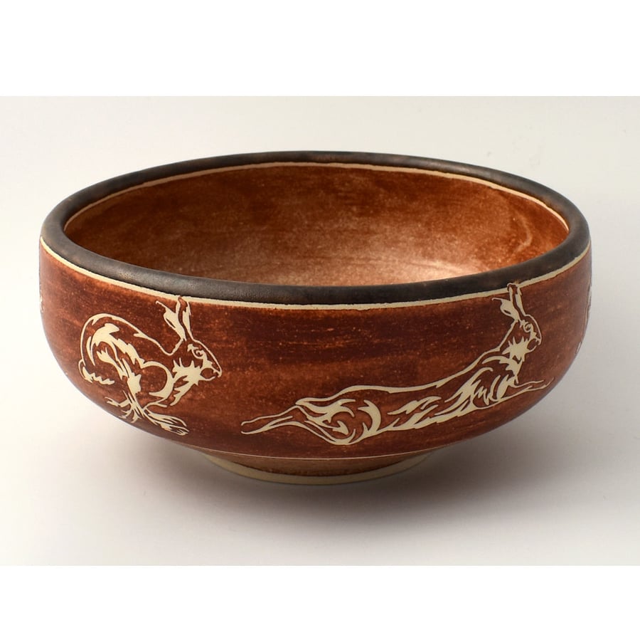 A331 - Ceramic bowl with running hares design  (Free UK postage)