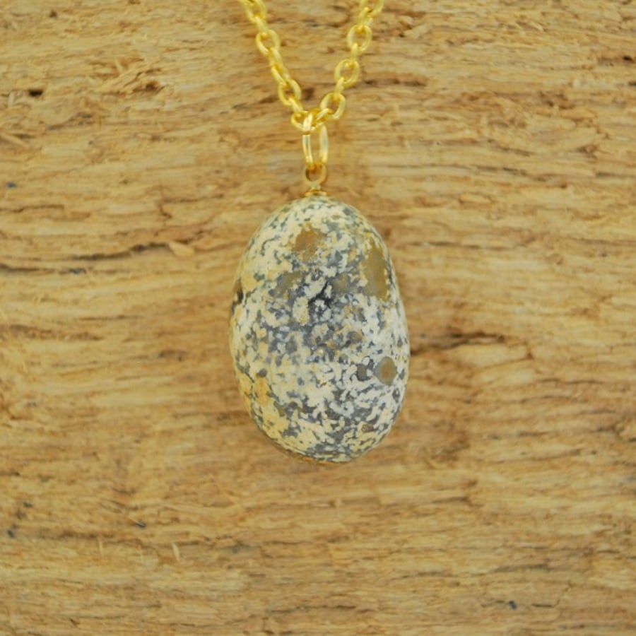 Polished flint stone pendant