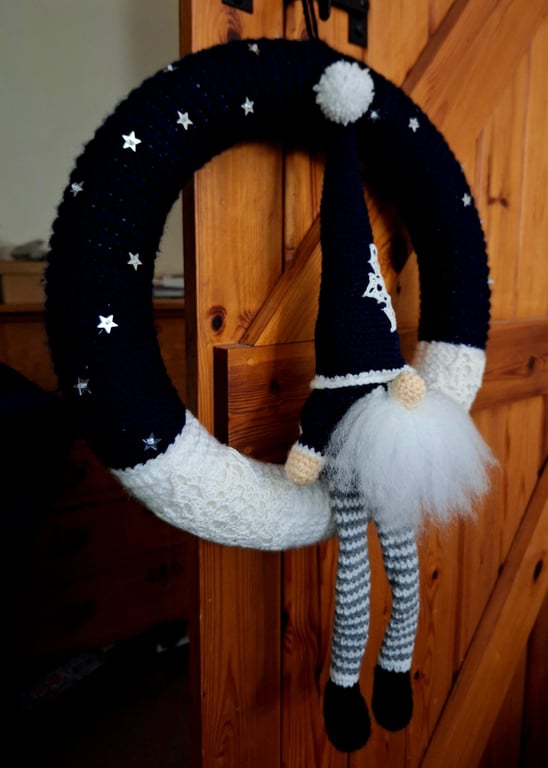 Festive crocheted wreath with gonk and snowflakes