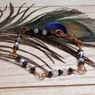 Twisted copper wire bracelet with black and white glass beads