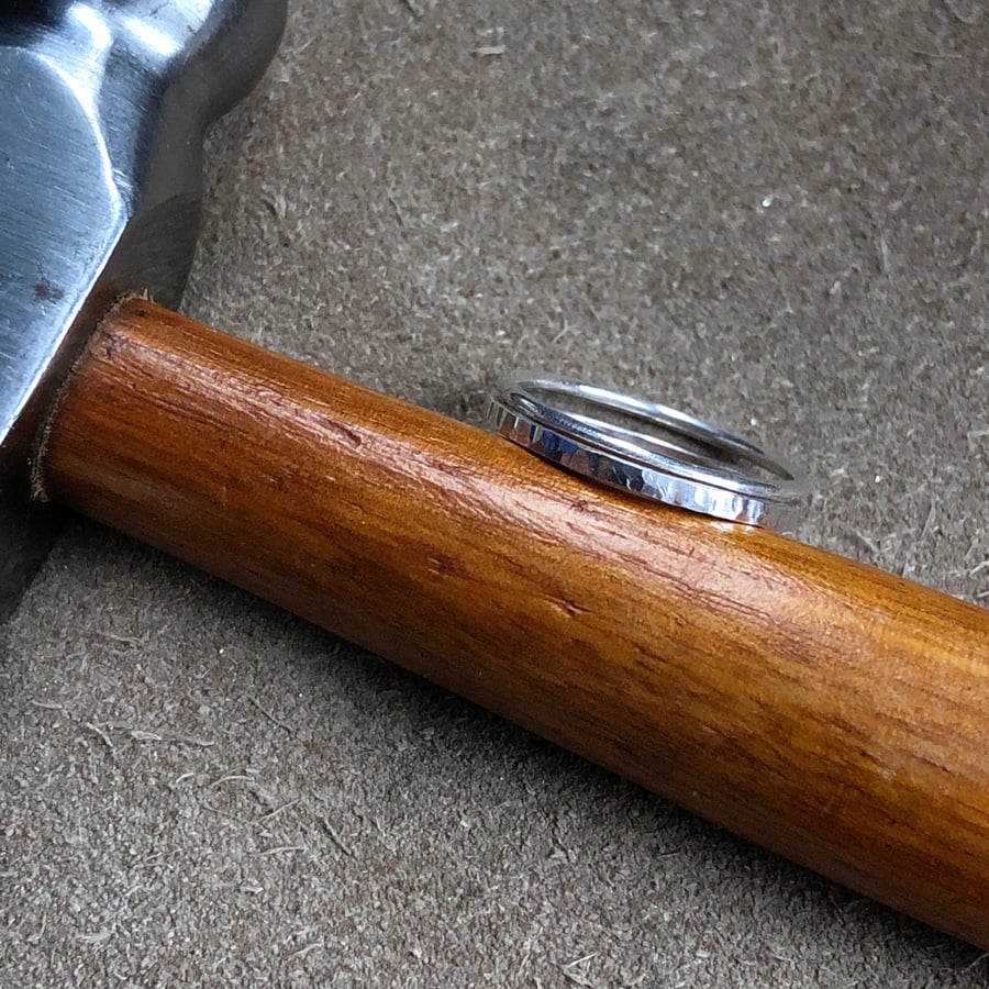 Sterling silver stacker ring set, one smooth and one hammered.