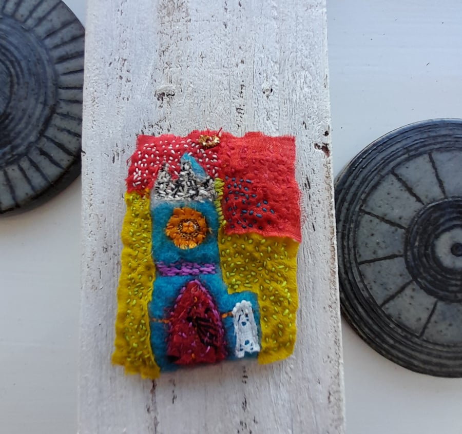 Brooch hand stitched