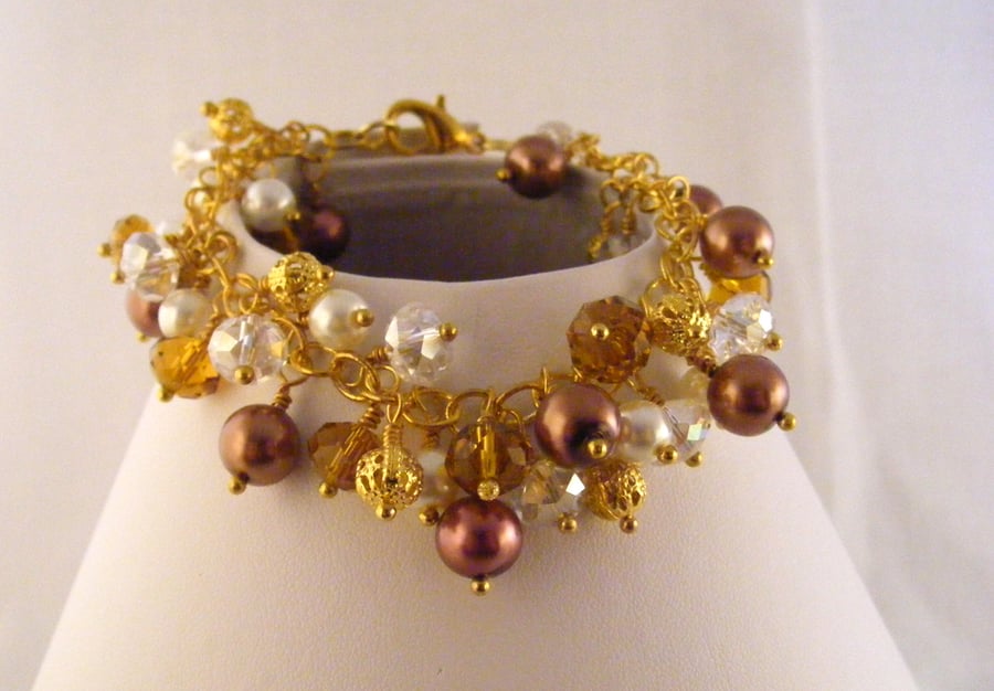 White, Mink, Topaz, Gold and Crystal Clear Charm Bracelet.