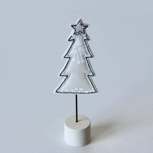 A Little Christmas Tree on a Painted Wooden Stand