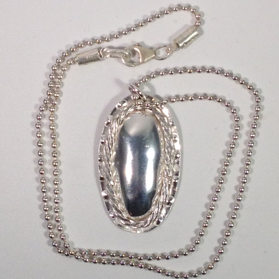 Silver oval domed pendant