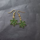 Green and gold snowflake charm dangle earrings 