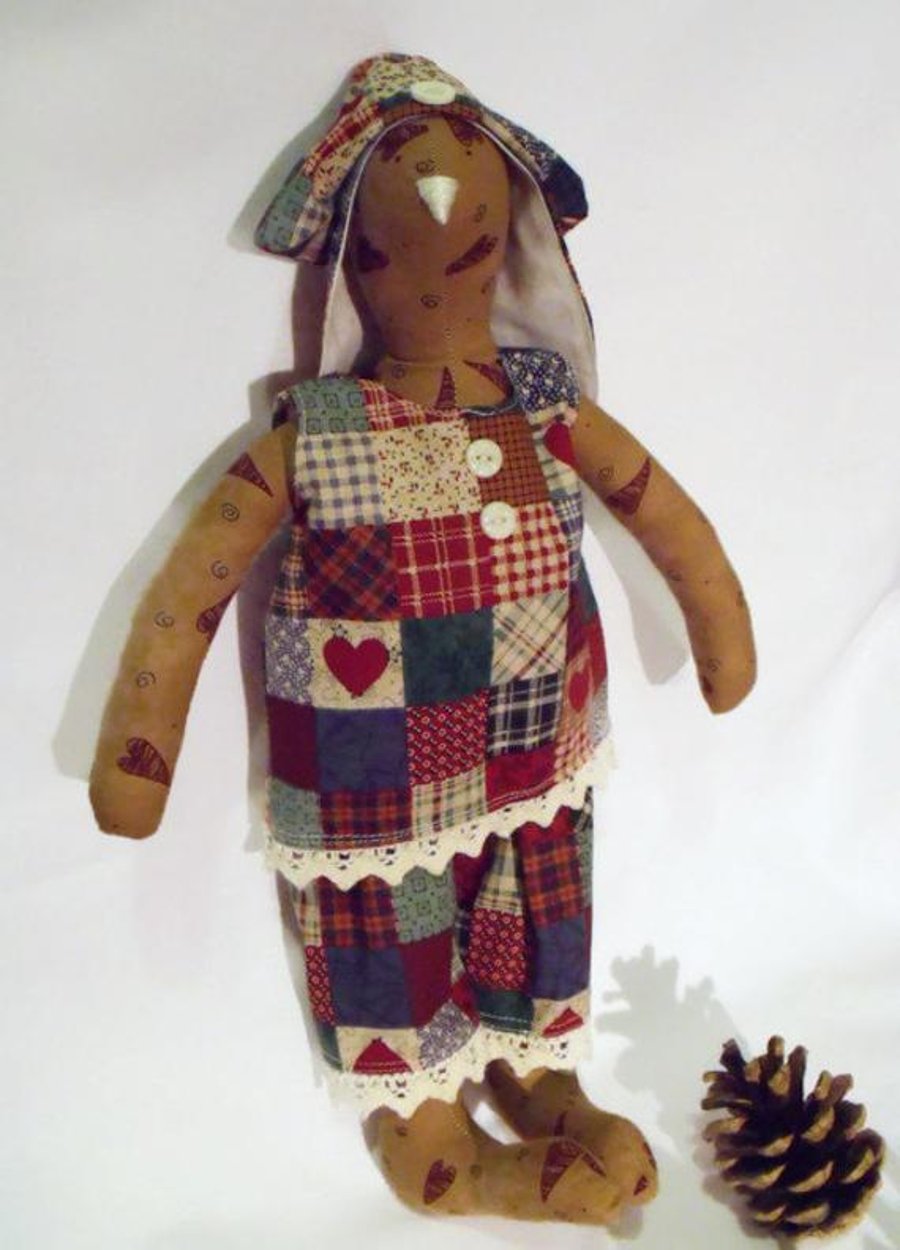 Tilda style tan primitive bunny rabbit doll for display, faux patchwork outfit