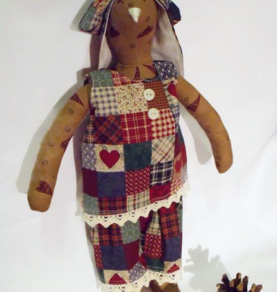 Tilda style tan primitive bunny rabbit doll for display, faux patchwork outfit