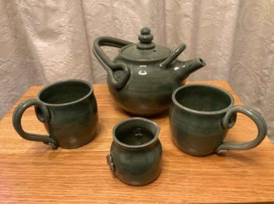 Tea for two!  Teapot, 2 mugs and pourer