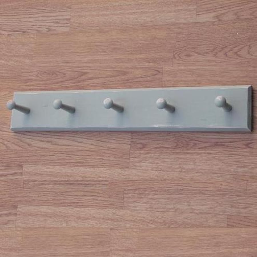 Painted and aged peg rack 