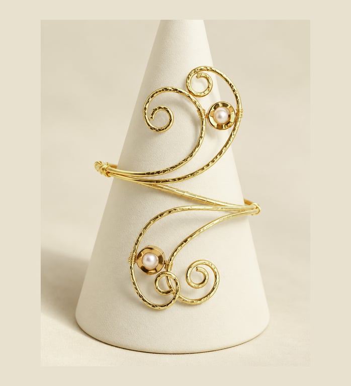 Elegant brass arm cuff with swirling design and pearls  and gold hematite 