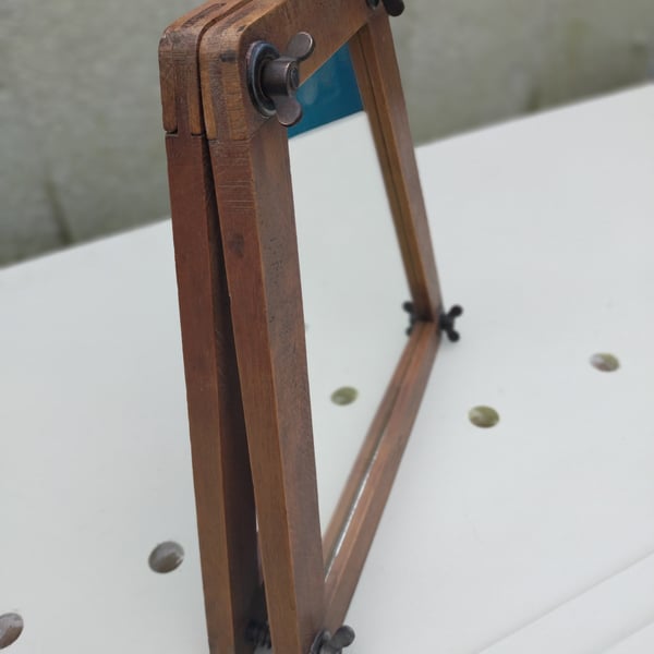 Vintage tennis racket press mirror.