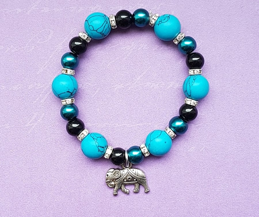 Turquoise beaded stretch bracelet with Elephant charm