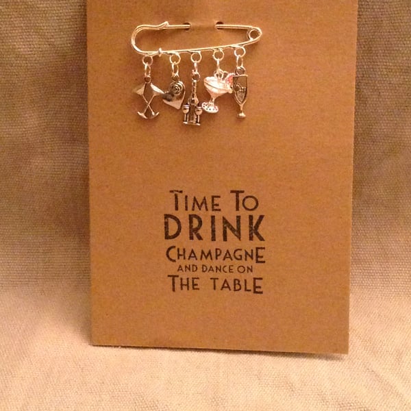 A6 kraft card with  detachable kilt pin brooch and matching stamped message