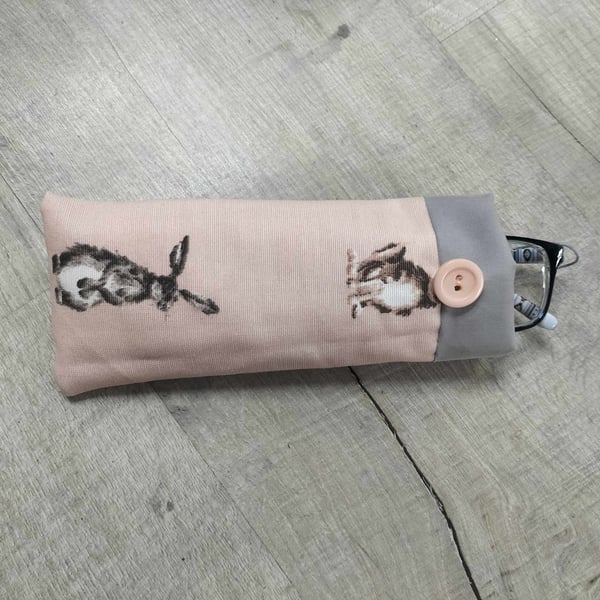 Glasses case with hares on pink background