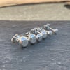 Hammer textured stud earrings, made from recycled silver.