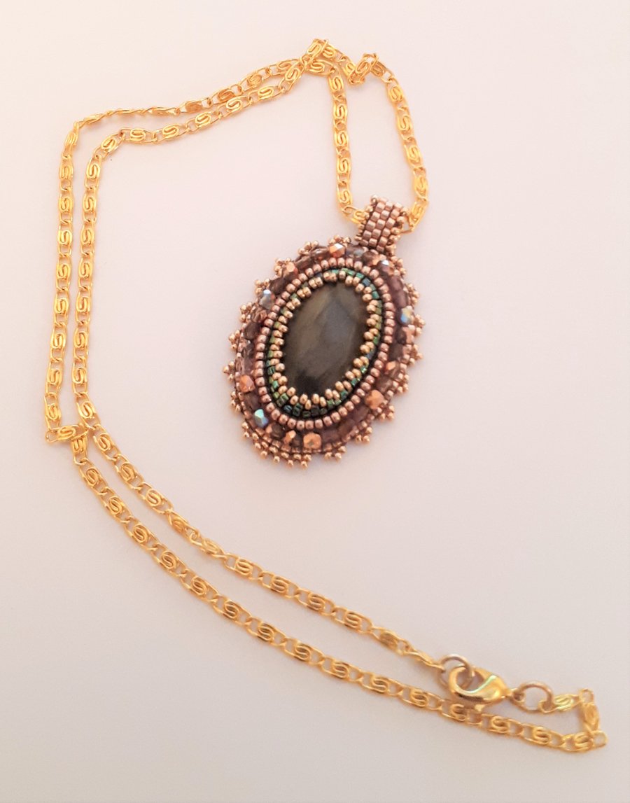 Bead embroidered Labradorite pendant on a gold tone chain  