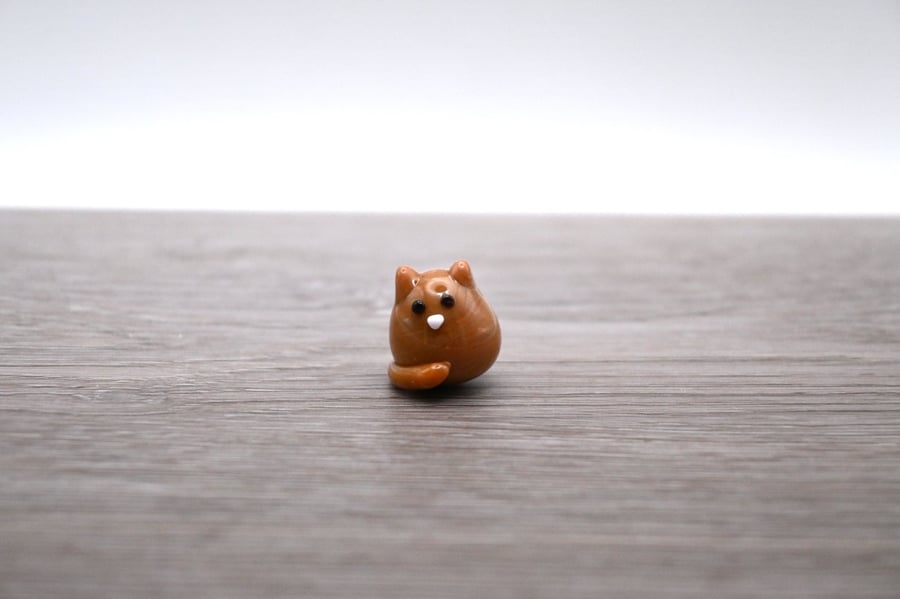 small glass cat figure