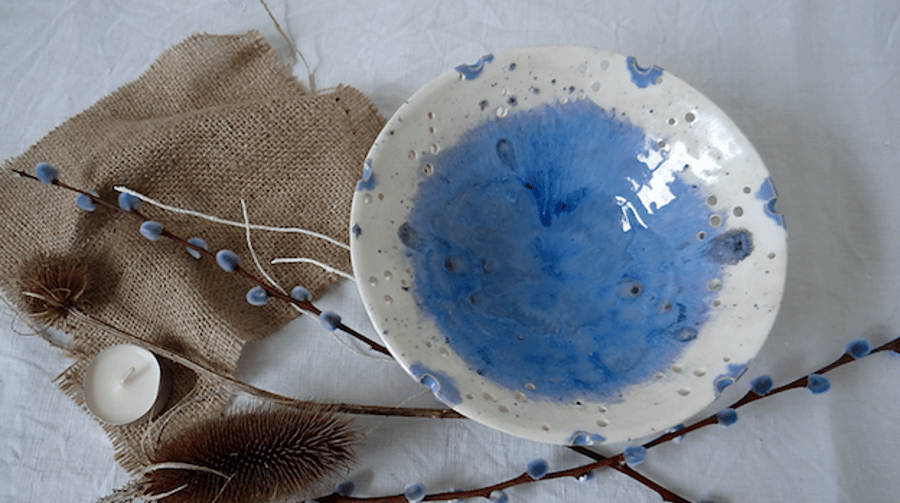 Handmade ceramic display bowl with decorative rim in blue and white