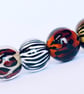 Handmade animal print patterned lamp work glass beads - Image 1