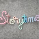 Storytime Knitted crochet wire sign Pastel