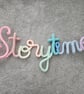 Storytime Knitted crochet wire sign Pastel