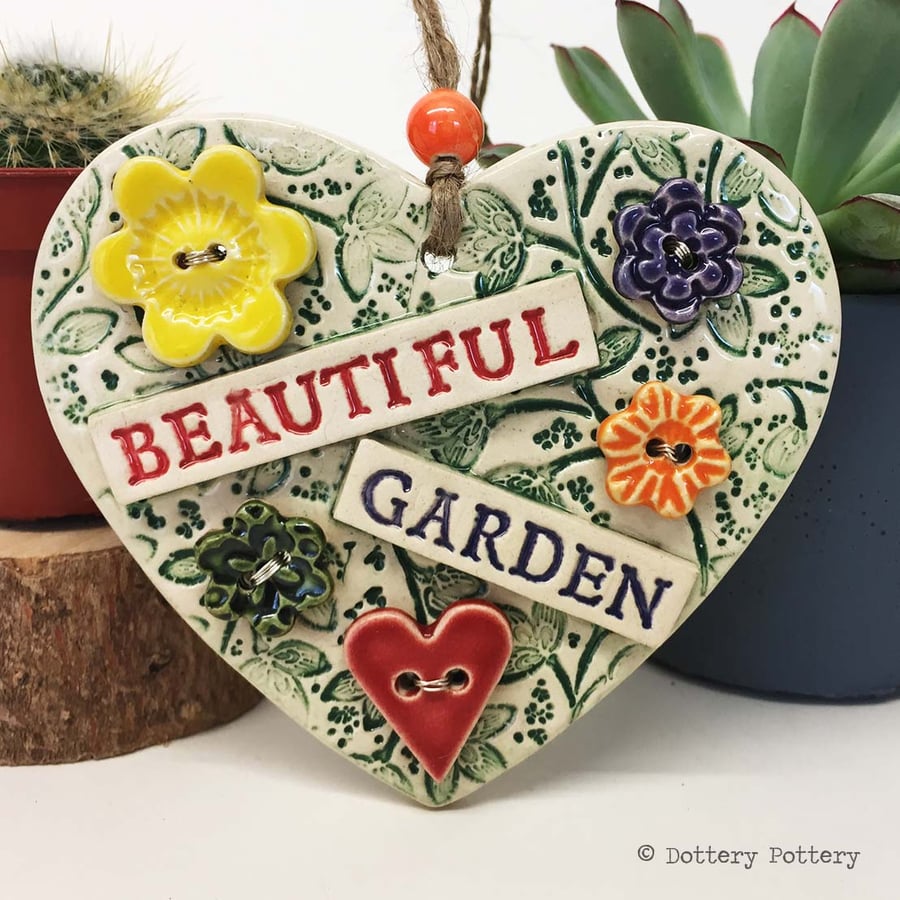 Ceramic heart decoration with button flowers Beautiful garden 