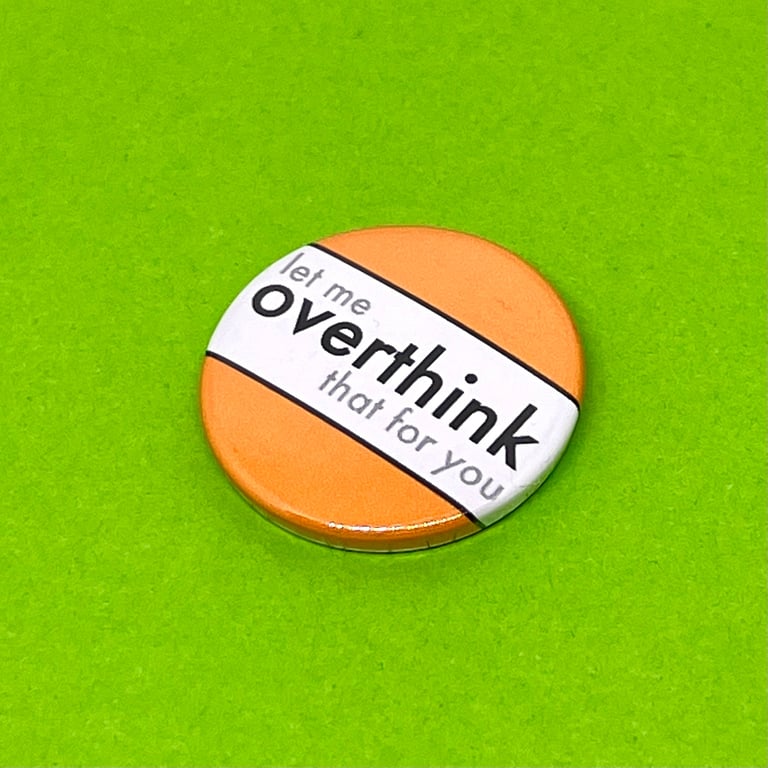 Let me overthink that for you. Badge, pocket pebble, magnet or keyring.