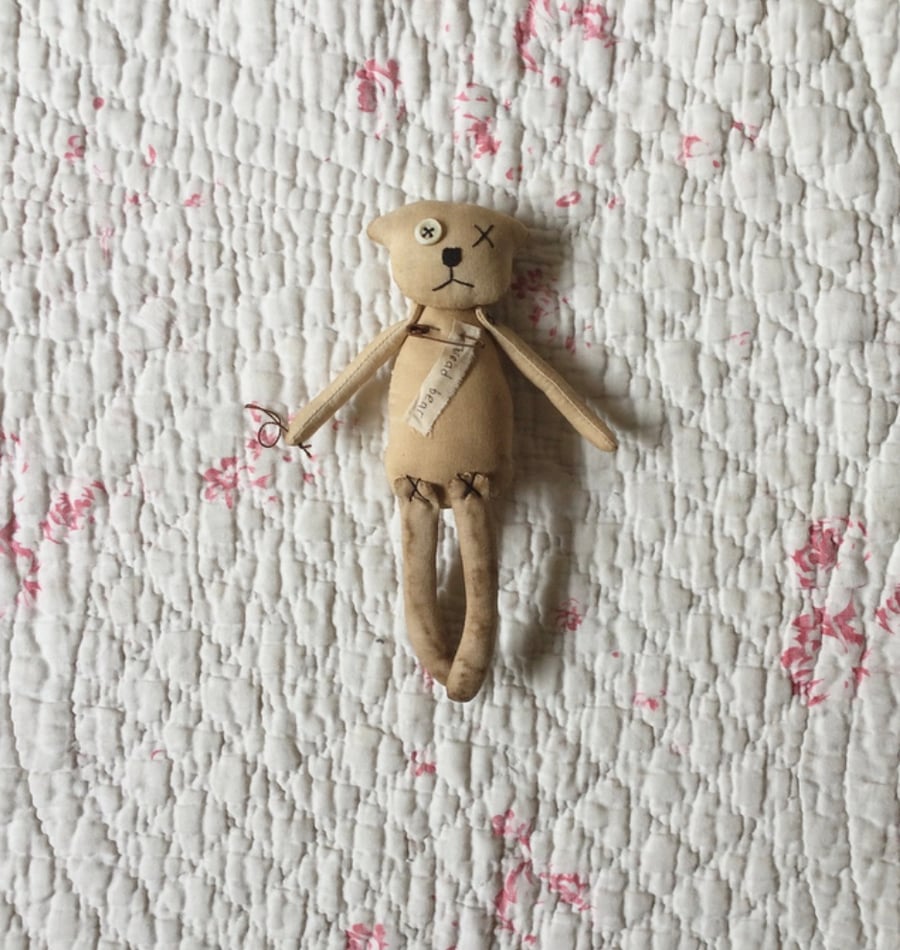 Thread bear with vintage fabric patch