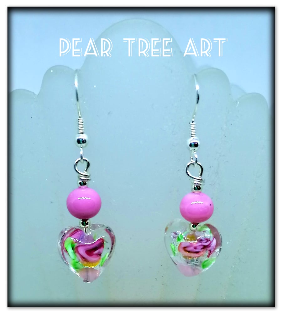 Pink Glass Heart drop earrings on Silver plated hooks.
