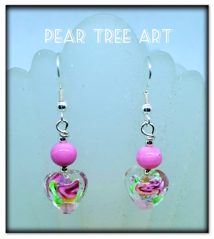 Murano glass pink flower heart drop bead earrings on Silver plated hooks.