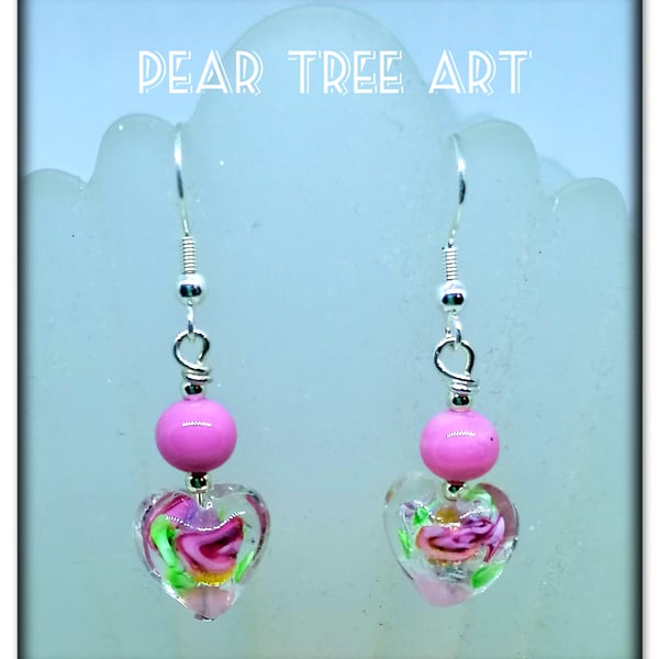 Murano glass pink flower heart drop bead earrings on Silver plated hooks.