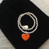 Orange enamel heart on silver beaded stretch bracelet. Stacking bracelet.