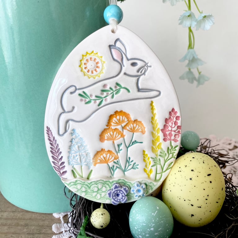 Large Ceramic Easter egg decoration leaping bunny over the meadow