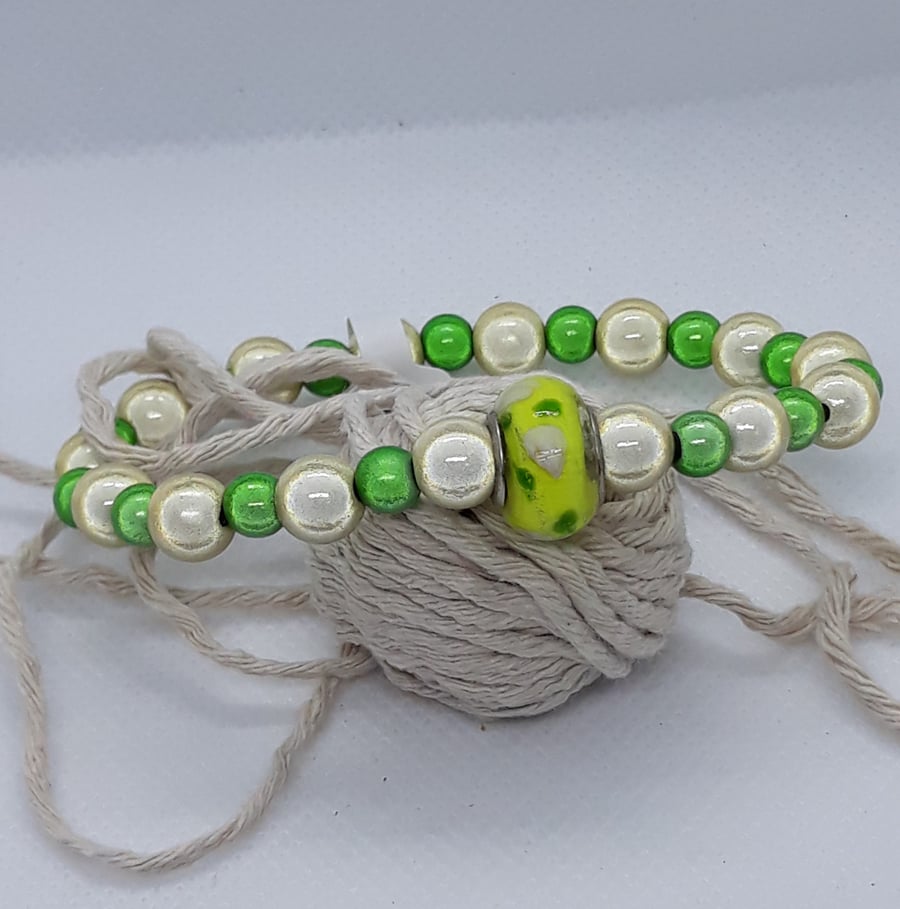BR369 Yellow and green miracle bead bracelet with glass feature bead