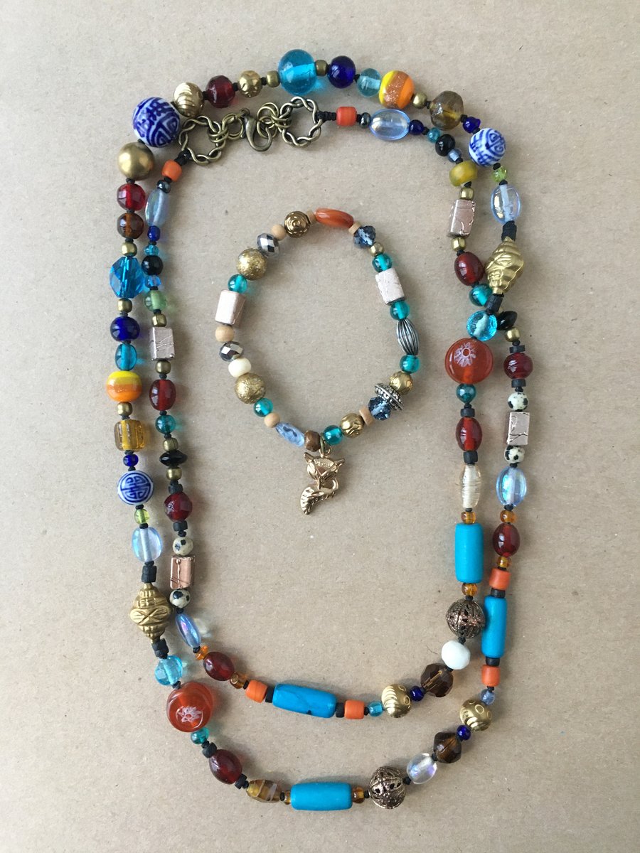 Gorgeous hand knotted 100 cm long statement necklace with various glass beads