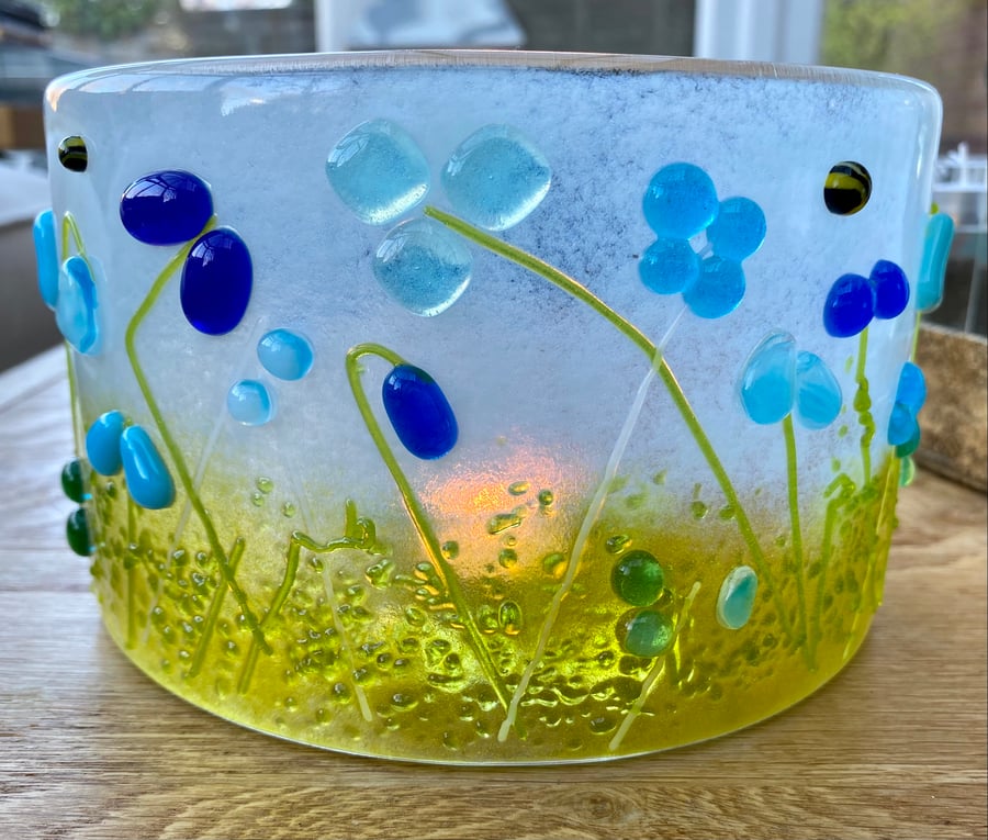 Curved freestanding fused glass meadow in shades of blue 