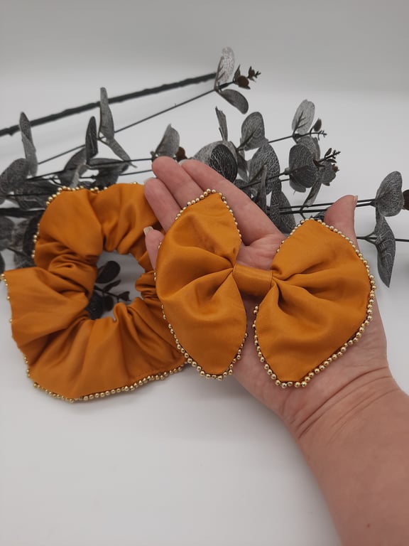 Hair clip on bow and scrunchie set in gold sateen with gold beaded edge. 
