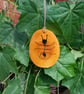 Bug pendant, could be an Ant.