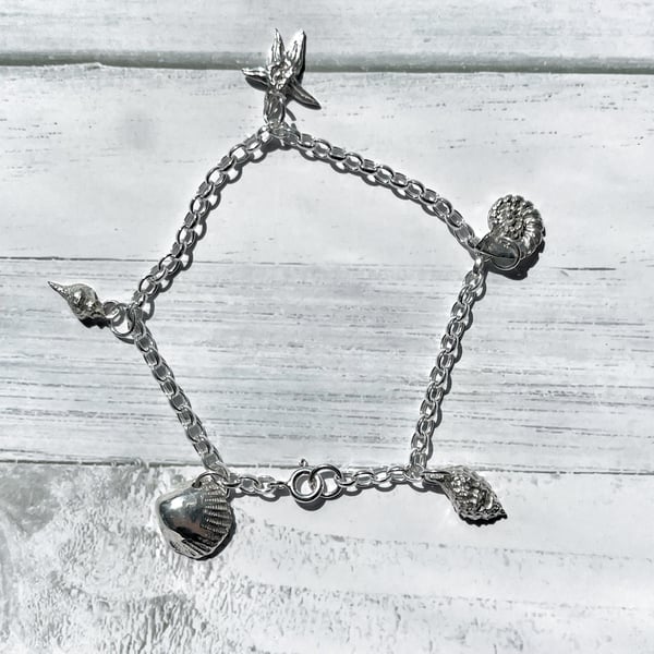 Silver charm bracelet: Handmade seaside shell charm bracelet 
