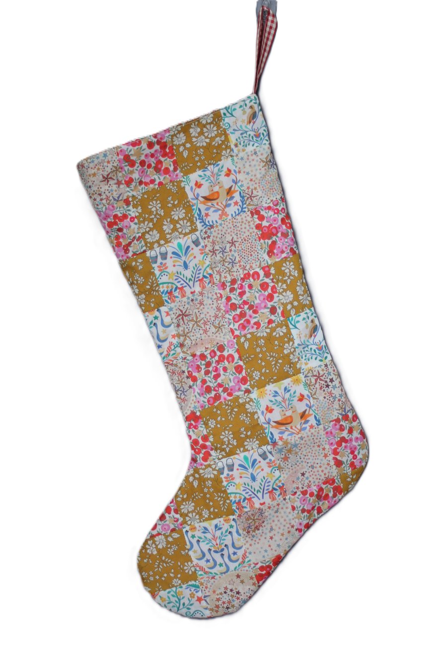 Patchwork stocking made from Liberty Tana Lawn fabric in gold, cream and pink 