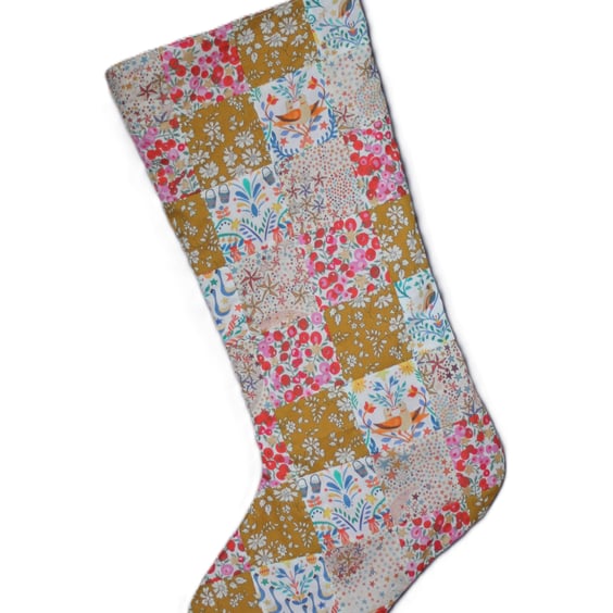 Patchwork stocking made from Liberty Tana Lawn fabric in gold, cream and pink 