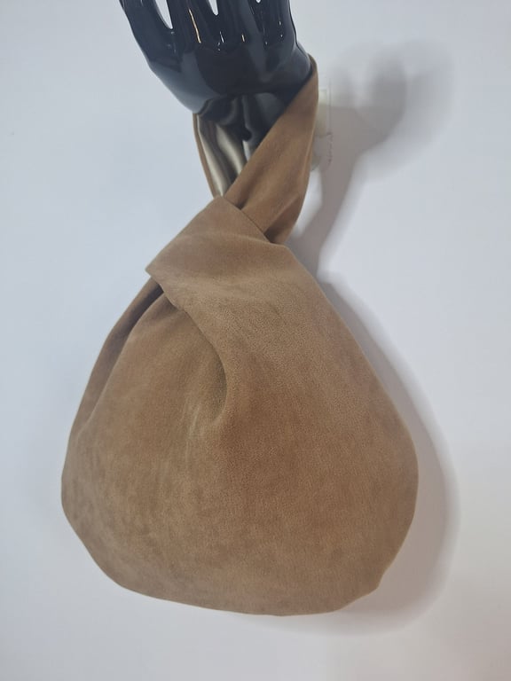 Faux suede brown Japanese knot bag with satin lining.