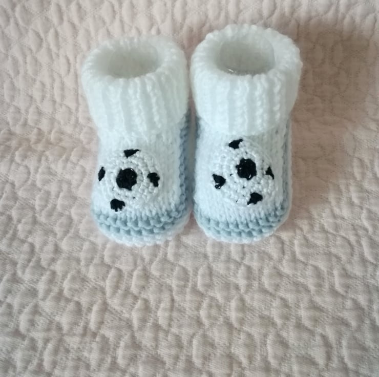 Hand knitted baby football booties
