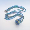 Lampwork glass bead with a sea theme on long necklace on shades of blue