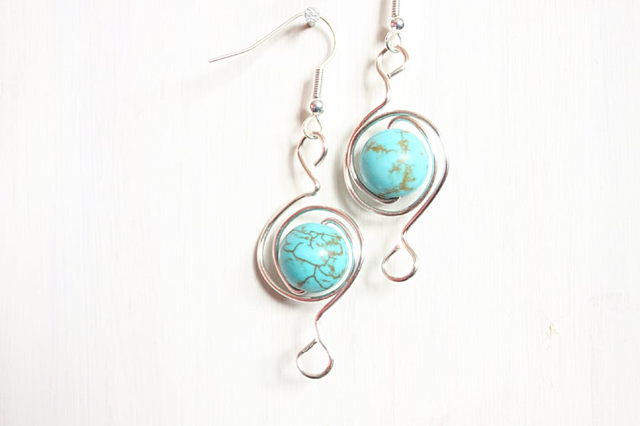 Dyed howlite and silver spiral dangle earrings