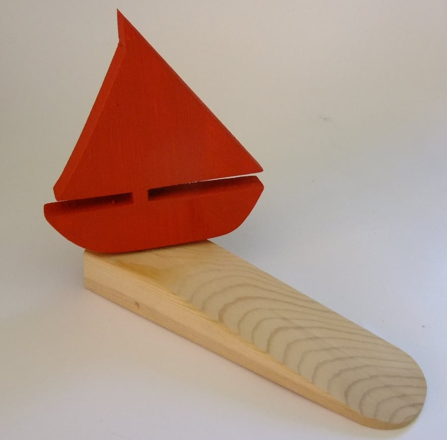 Door wedge with a yatch or boat. Ideal for seaside cottage or beach hut. 