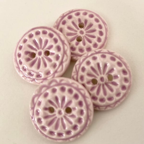Set of four handmade ceramic buttons pink