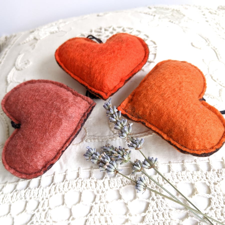 Three lavender hearts in shades of orange