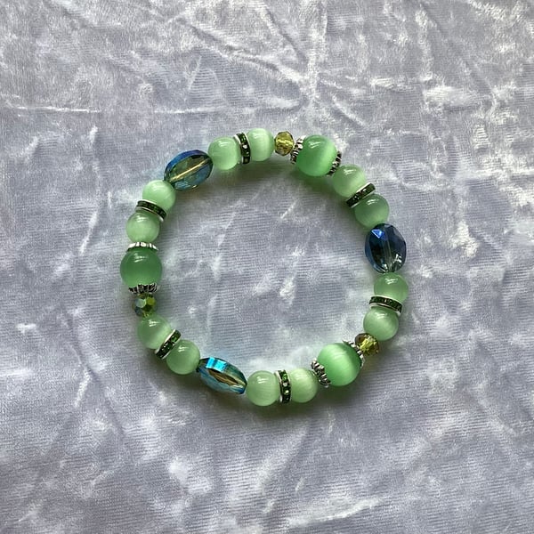 Stretchy Green bracelet, Cats Eye Beads